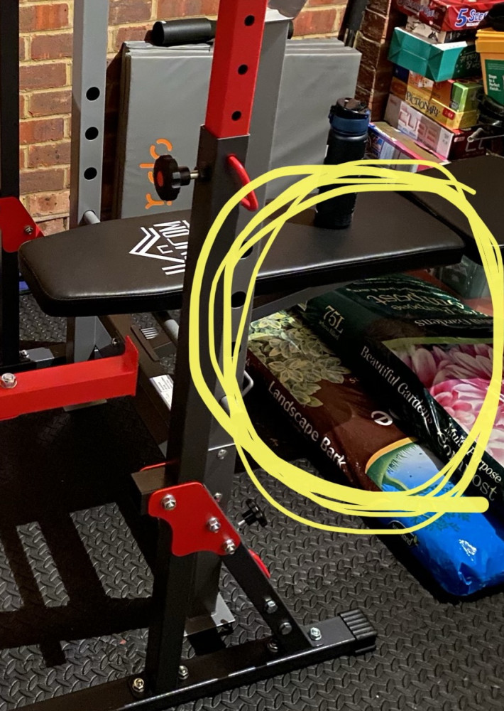 Weight bench set up in my garage with Compost bag steps