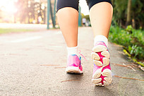 Lady walking on pavement