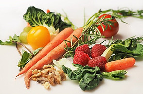 How to start going vegan - Eating a balanced diet including carrots, pepper, strawberries, walnuts and rosemary