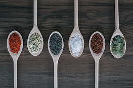 Various spices on wooden sooons